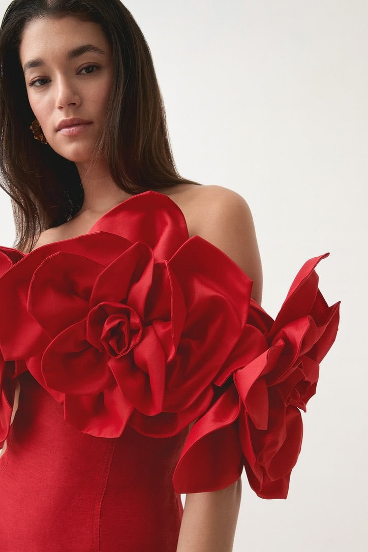 Wren, a beautiful red midi with oversized sculptural floral sleeves and a soft A line shape.