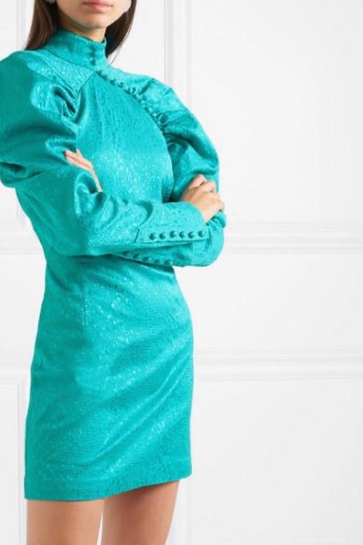 Terry, a turquoise jacquard mini with a striking high neckline and covered button fastening.
