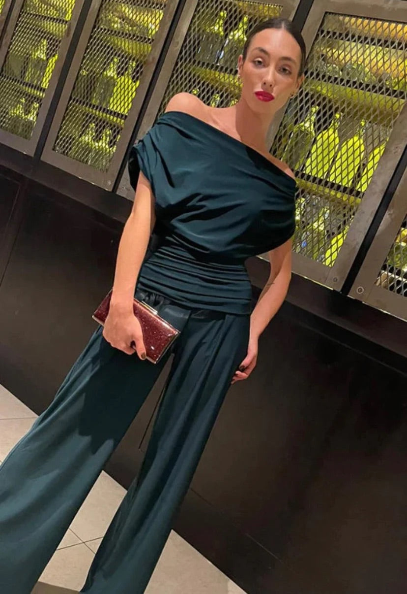 Talia, green jumpsuit, third view.