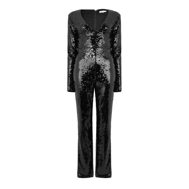 Victoria, a full length black jumpsuit covered in sequins, with a sharp V neckline and long sleeves.
