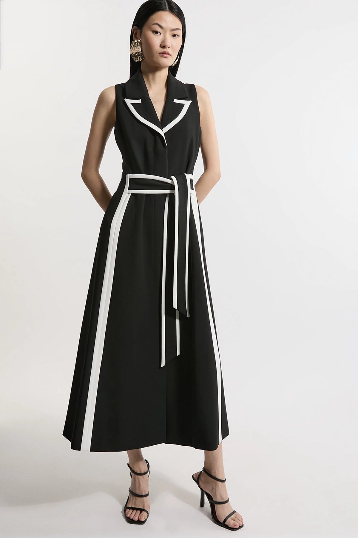 Sloane, a black and white wrap dress with a flared skirt and pretty trim detail.