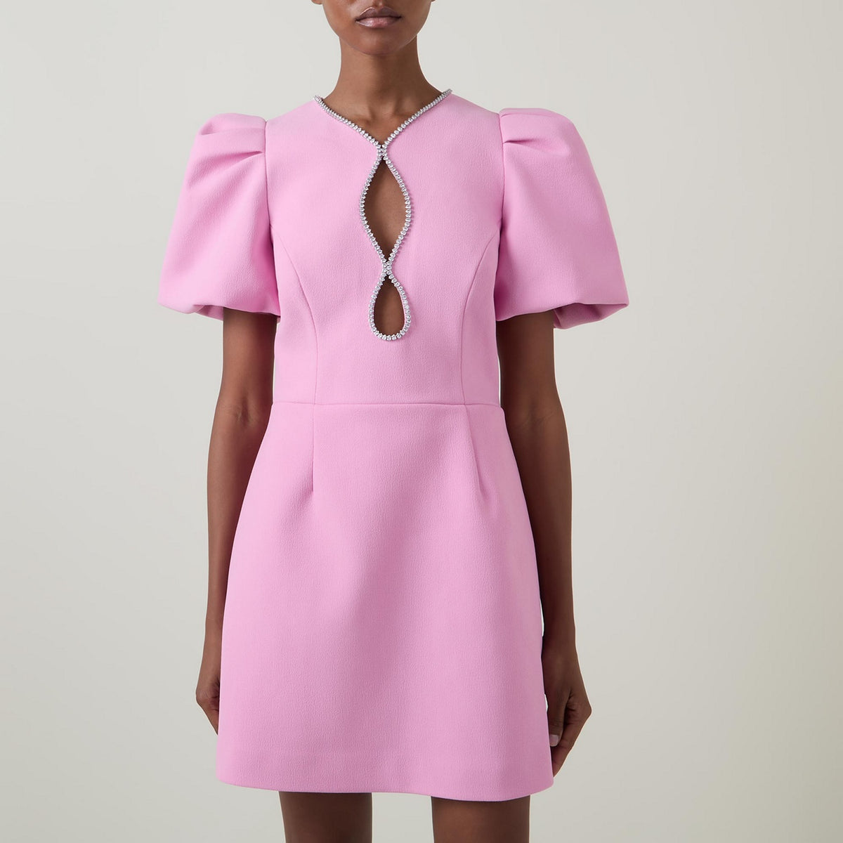 Ashley, a pink mini with a fitted bodice, puff sleeves and an A line skirt.