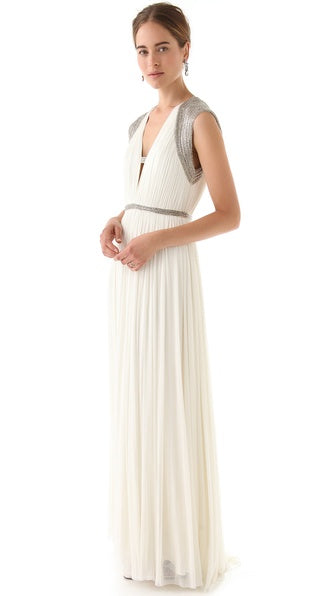 Briar, a soft ivory gown in a lightweight pleated fabric with a romantic deep V neckline.