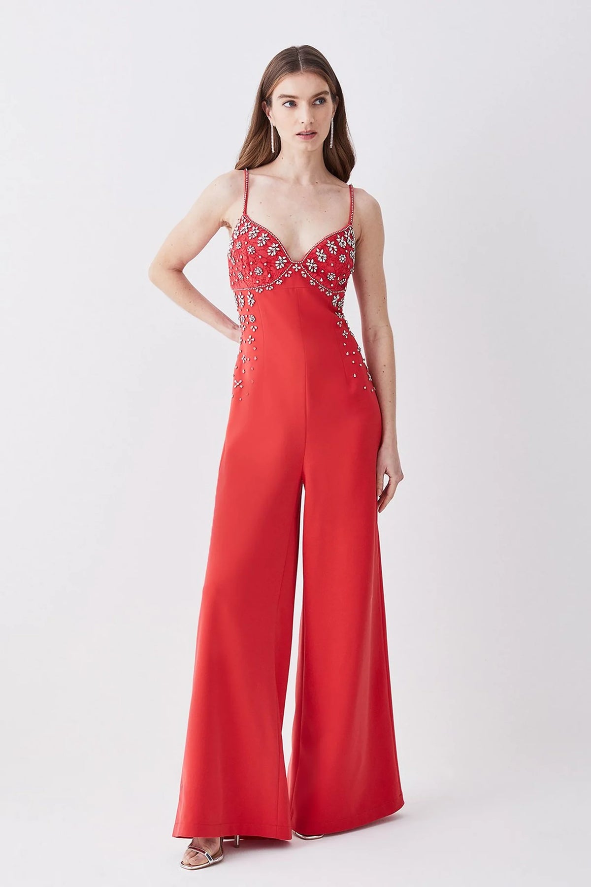 Scarlett, a red wide leg jumpsuit with a glamorous embellished neckline and thin shoulder straps.