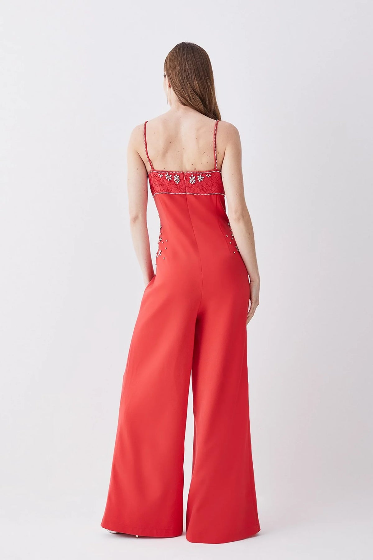 Scarlett, red jumpsuit, third view.
