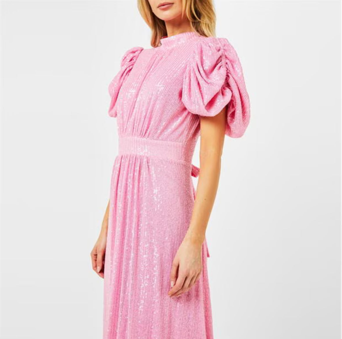 Belle, a romantic pink sequinned midi with a high neck, gathered puff sleeves and a full skirt that moves.